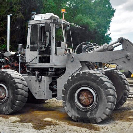 Wheel loader blasted down to bare metal