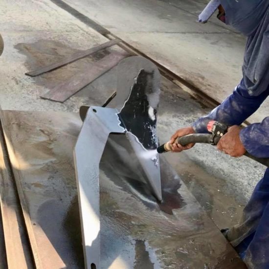 Blasting coating off a boat anchor